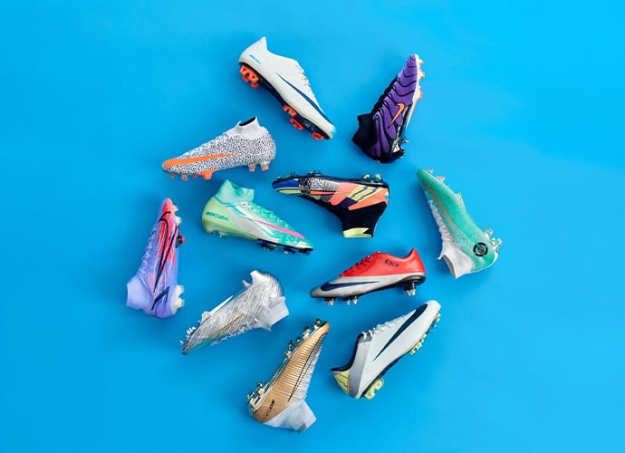 Twelve Nike Mercurial Superfly boots displayed in circular arrangement featuring diverse color options from white to purple gradient
