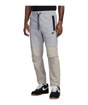 nike-dri-fit-tech-woven-hose-grau-f012-hm8241-lifestyle_front.png