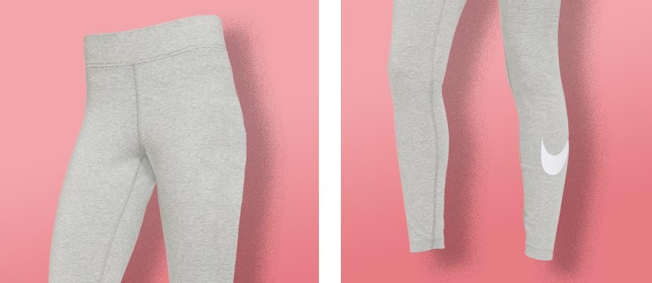 Nike Essentials Leggings Damen Grau F063 vor einem rosa Hintergrund