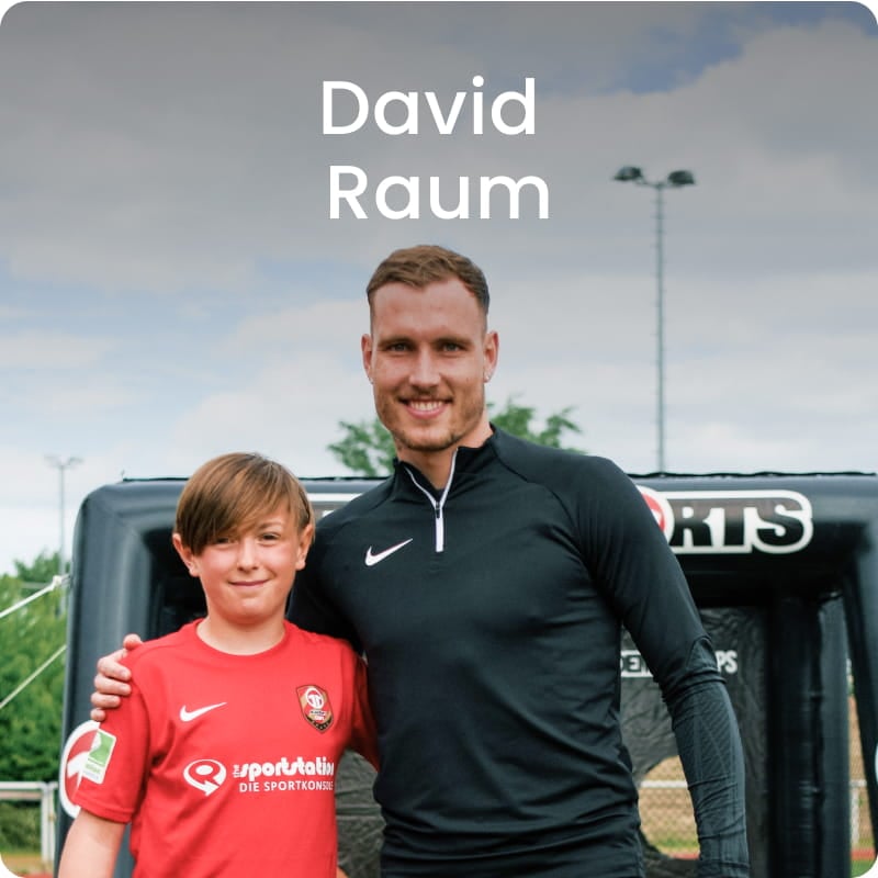 German international David Raum posing with young boy in blue football kit - 11teamsports Football Academy ambassador