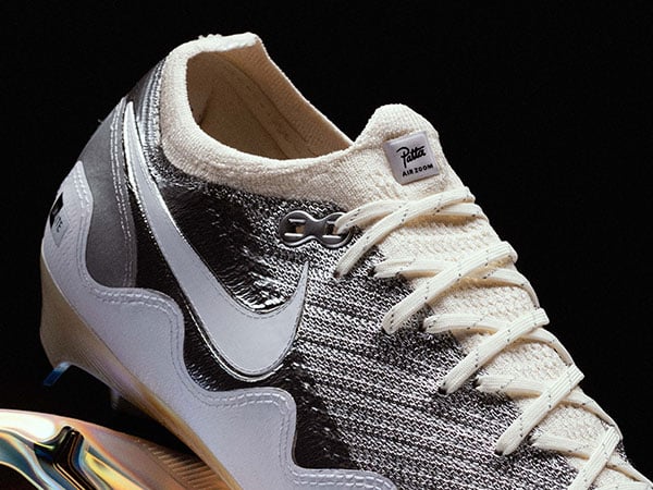 Nike x Patta Vapor 16 UNITE &ndash; detail view on lateral rear section with Flyknit Collar, Patta label on the tongue lip, lacing and white waves sewn on the lateral side
