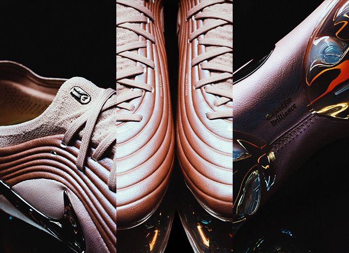 Three premium football boots displayed side by side: white Nike boot with ribbed texture, copper-colored Nike Tiempo Maestro with layered design, and black boot with colorful rainbow accents against dark background