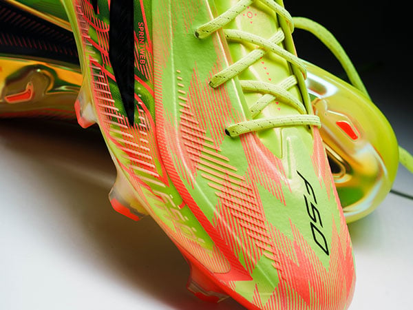 Closeup on the toebox of the adidas F50 Hyperfast ELITE FG in first launch edition with grip elements