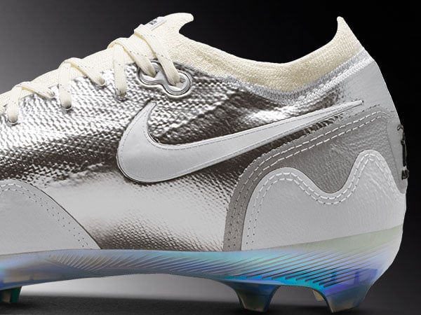 Nike x Patta Vapor 16 Pro Kids UNITE &ndash; detail view on lateral inside heel Section of the right boot with white Patta waves with focus on Swoosh