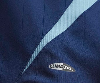 Retro Climacool logo with gold piping and light blue mesh side inserts on the dark blue away jersey