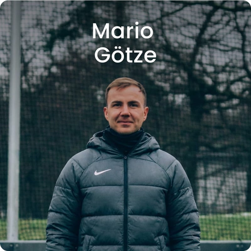 German international Mario Götze posing with in black football kit - 11teamsports Football Academy ambassador
