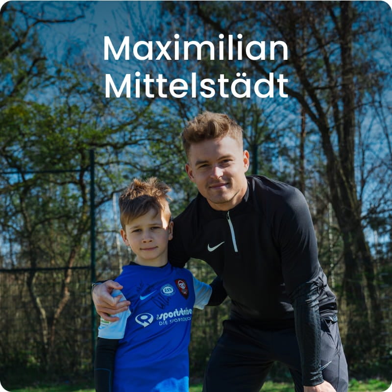 German international Maximilian Mittelstädt posing with young boy in blue football kit - 11teamsports Football Academy ambassador