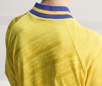 Back view showing raglan cut, SvFF federation logo as Jacquard pattern and bold striped collar of the Sweden 1994 jersey