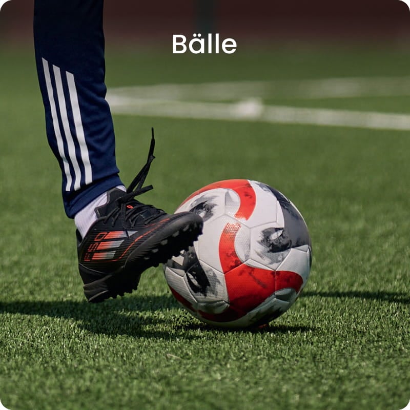 Football player kicking ball on grass - Football balls collection at 11teamsports