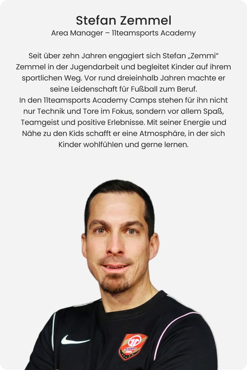 Stefan Zemmi Zemmel, Area Manager at 11teamsports Academy, smiling with arms crossed in black Nike long-sleeve shirt with Academy badge