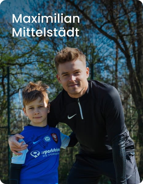 German international Maximilian Mittelstädt posing with young boy in blue football kit - 11teamsports Football Academy ambassador