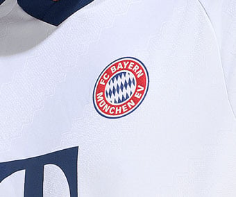 Embroidered old FC Bayern e.V. emblem on jacquard knit fabric