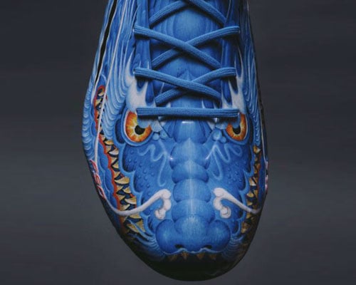 Closeup on toebox of adidas x Y-3 F50 with legendary 2006 beast pack dragon design