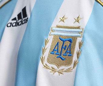 Embroidered adidas Performance logo and official AFA federation crest on chest of the home jersey