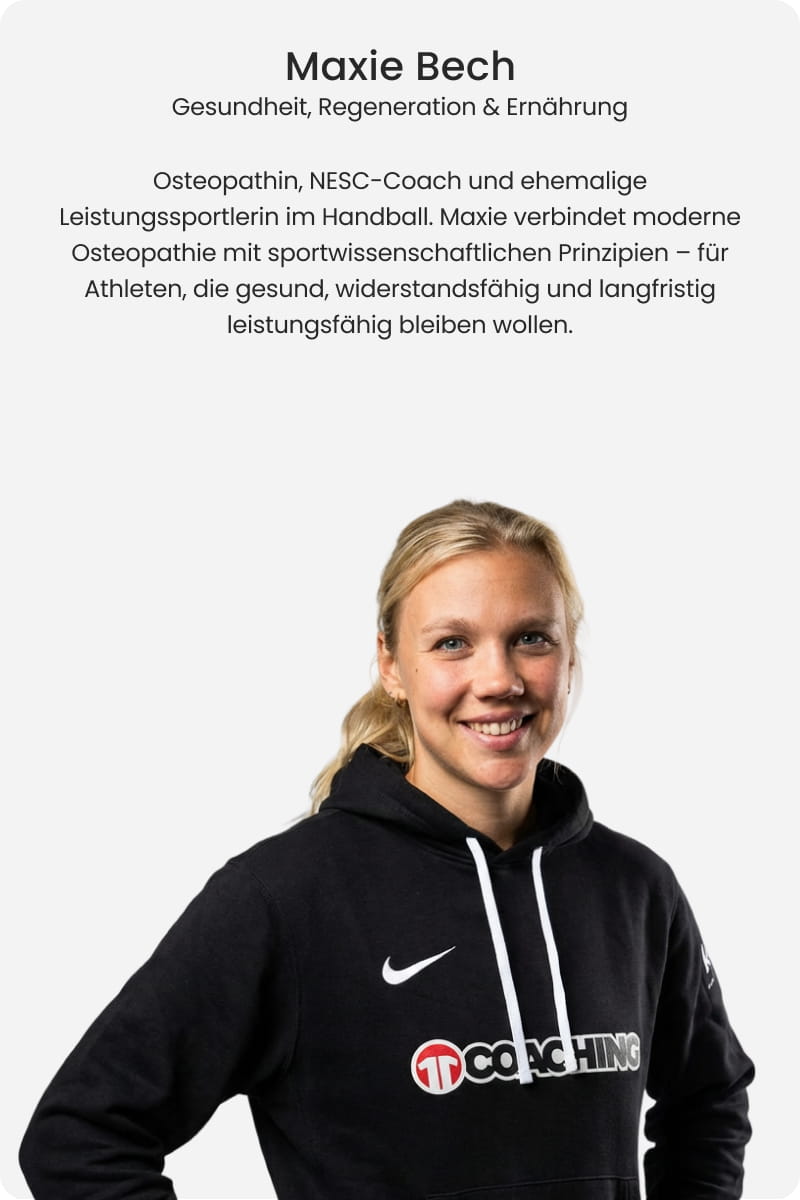 Maxie Bech, osteopath, NESC coach and former professional handball player, smiling in black Nike 11Coaching hoodie - Health, regeneration and nutrition expert at 11teamsports Football Academy