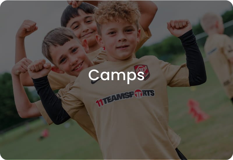 Three happy boys flexing muscles in golden 11teamsports football kits - Book children's football camps now at 11teamsports Academy